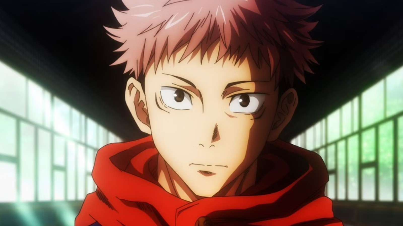 un garçon aux cheveux roses (yuji) dans jujutsu kaisen